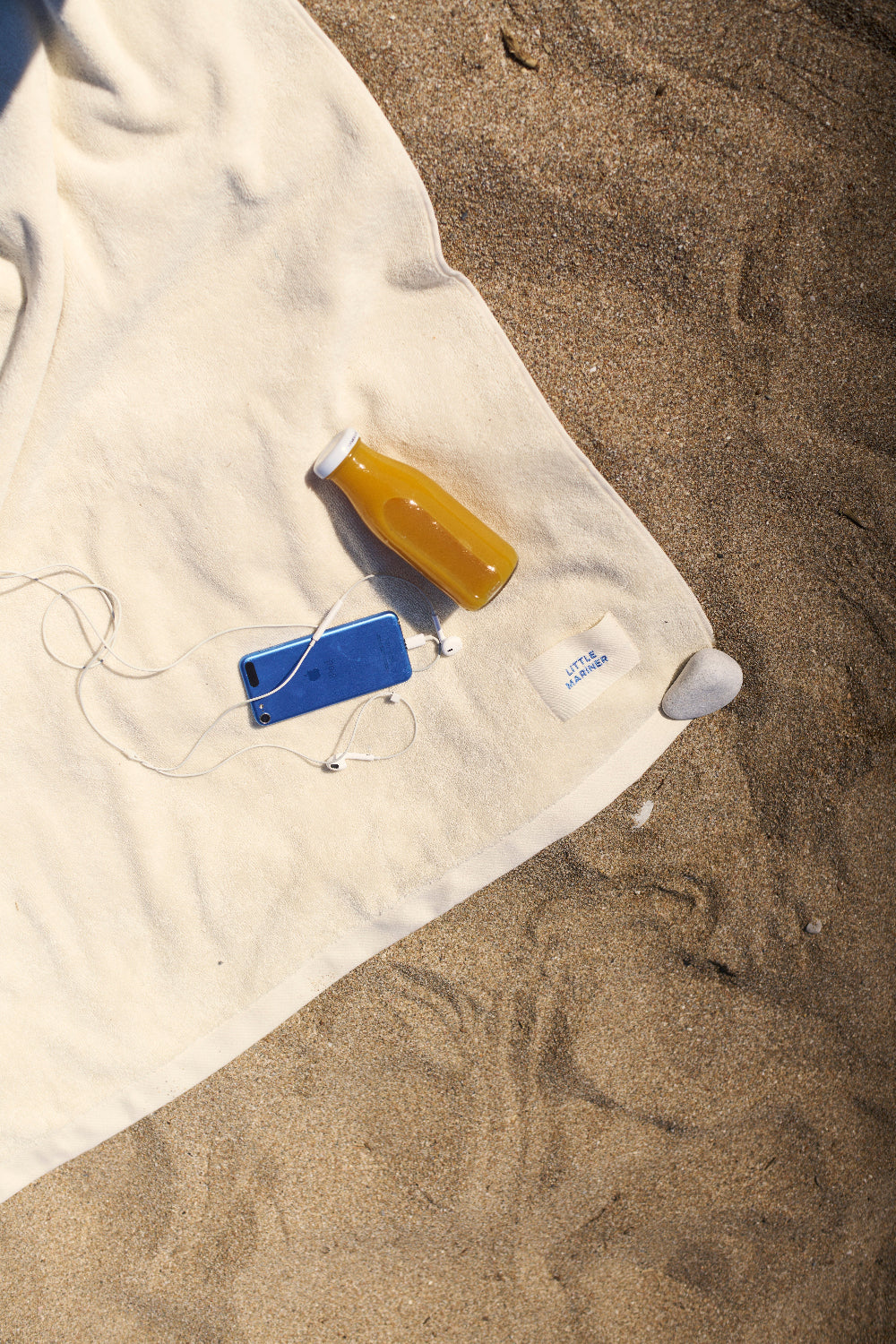 Soft off-white beach towel for poolside and bathroom use