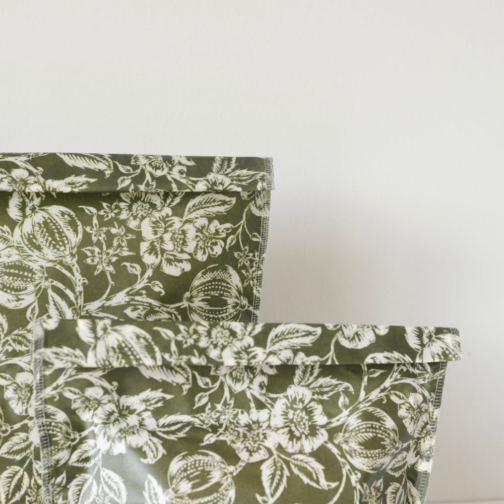 Floral patterned beeswax food storage bags close up on a white background