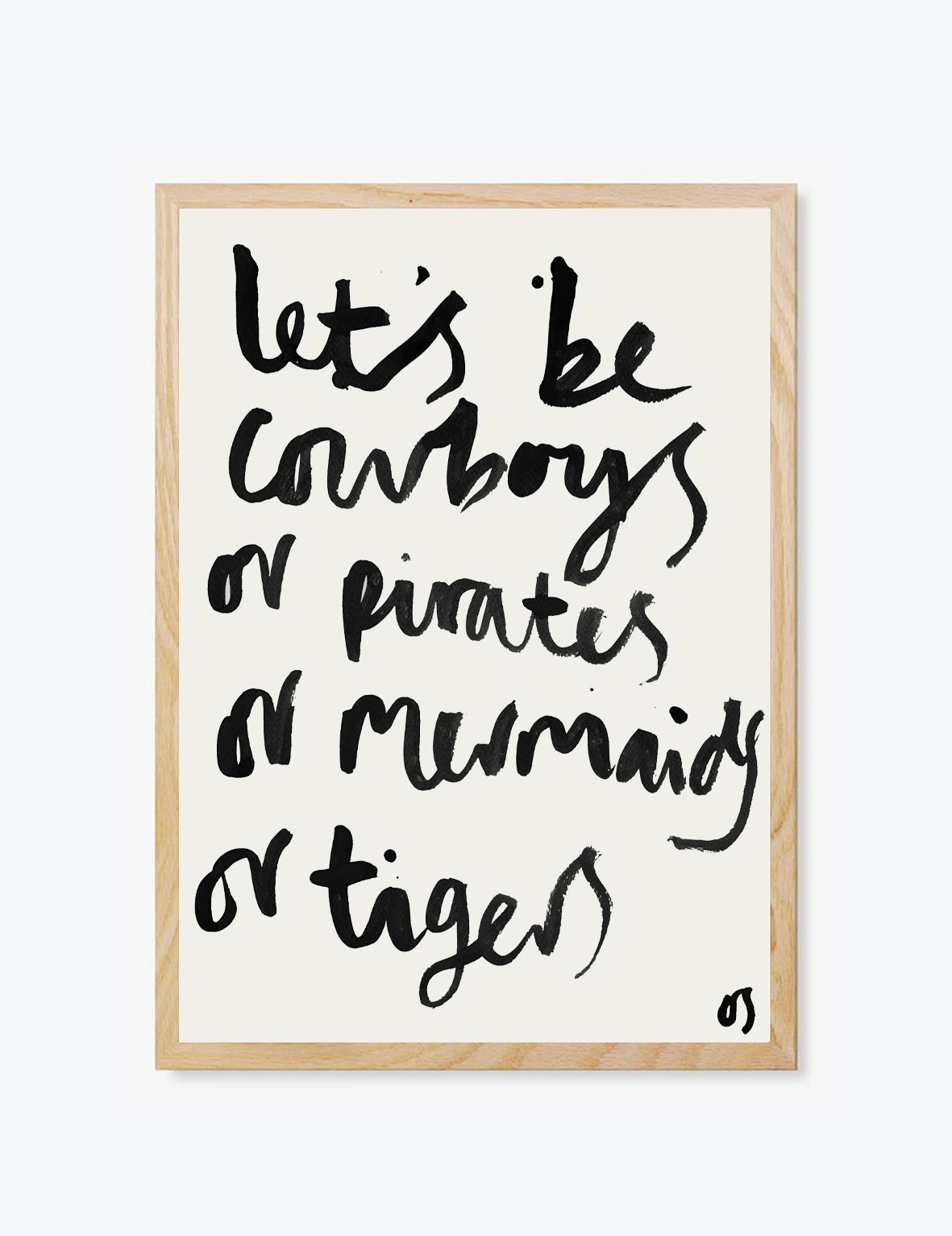 Framed print with black text 'Lets be cowboys or pirates or mermaids or tigers' on a white background