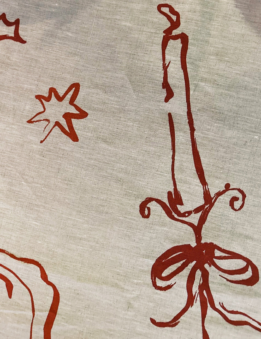 Linen tablecloth with christmas patterns on a beige background