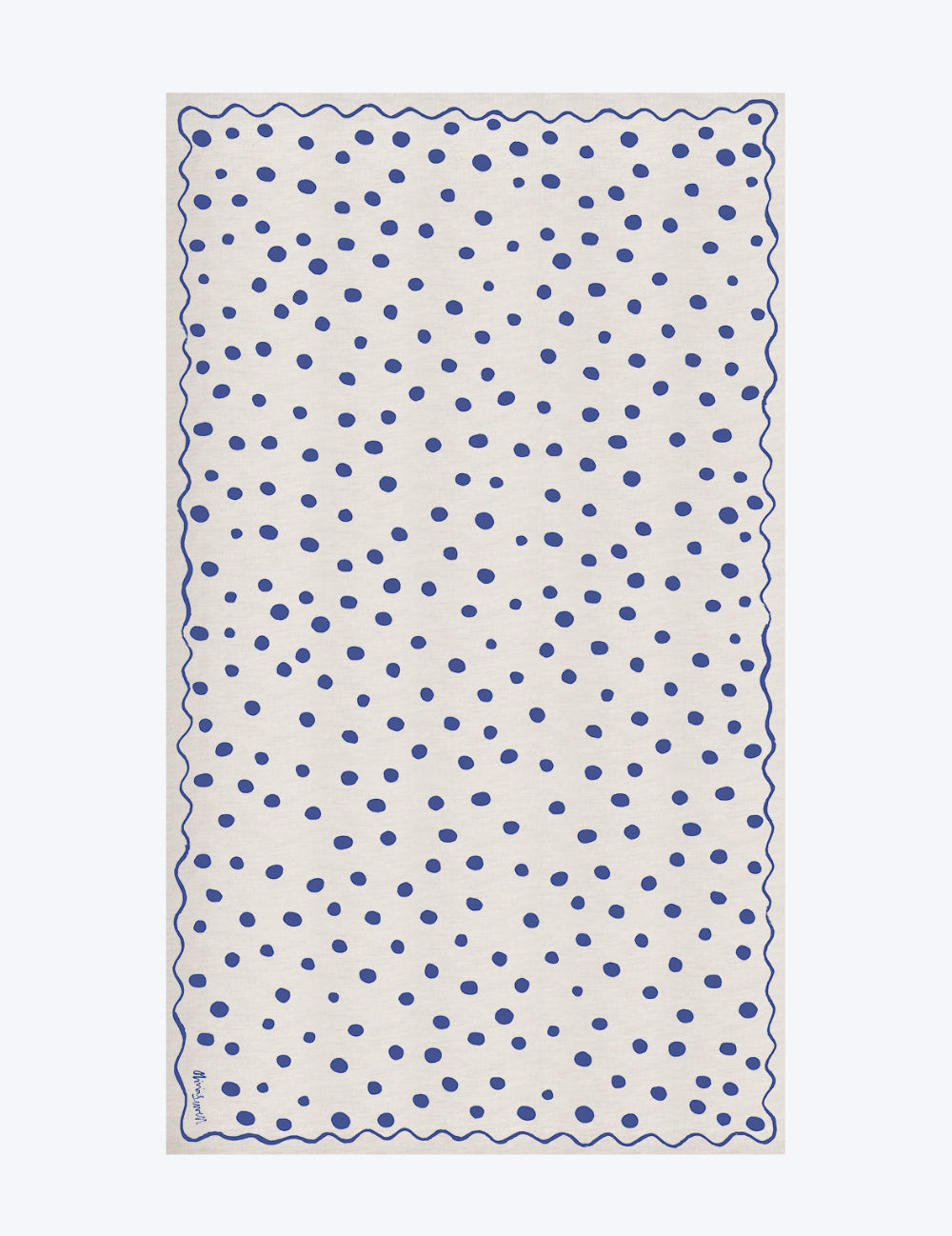 Rectangular towel with blue polka dot pattern on a white background