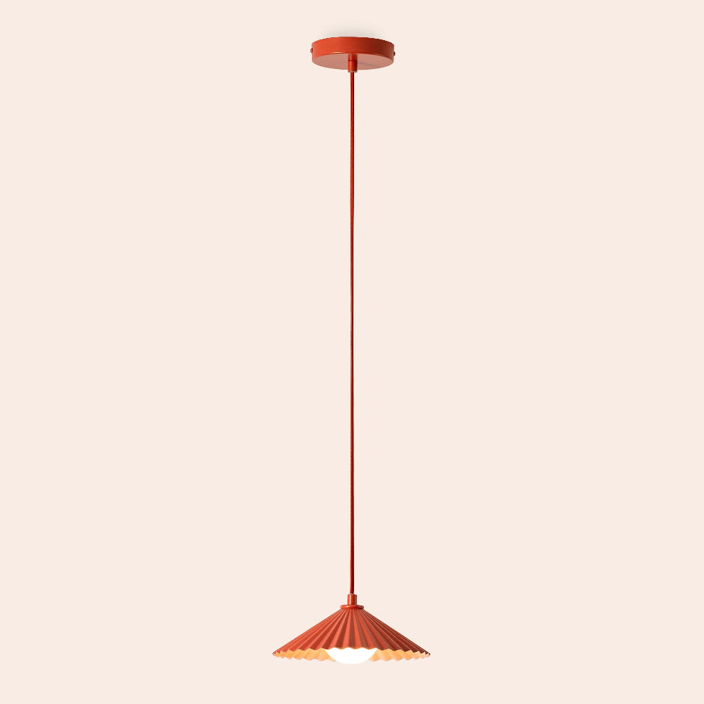 Burnt orange pendant light on a beige background
