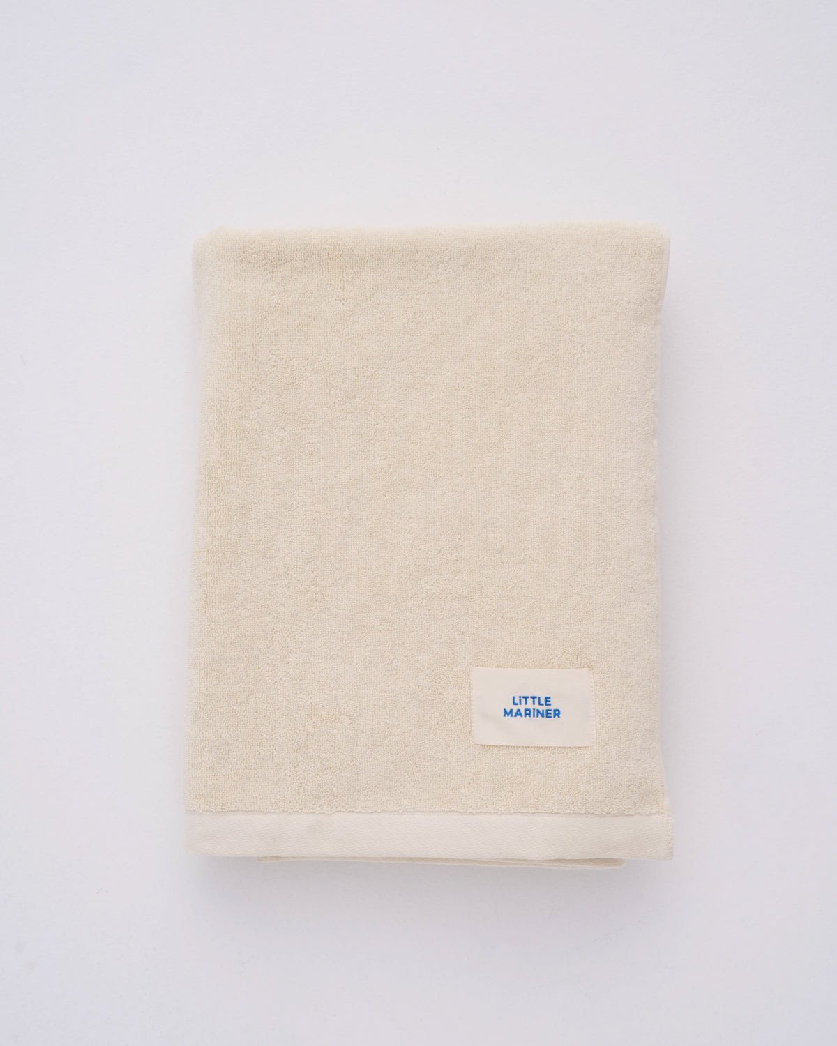 Off-white organic cotton beach towel by Little Mariner