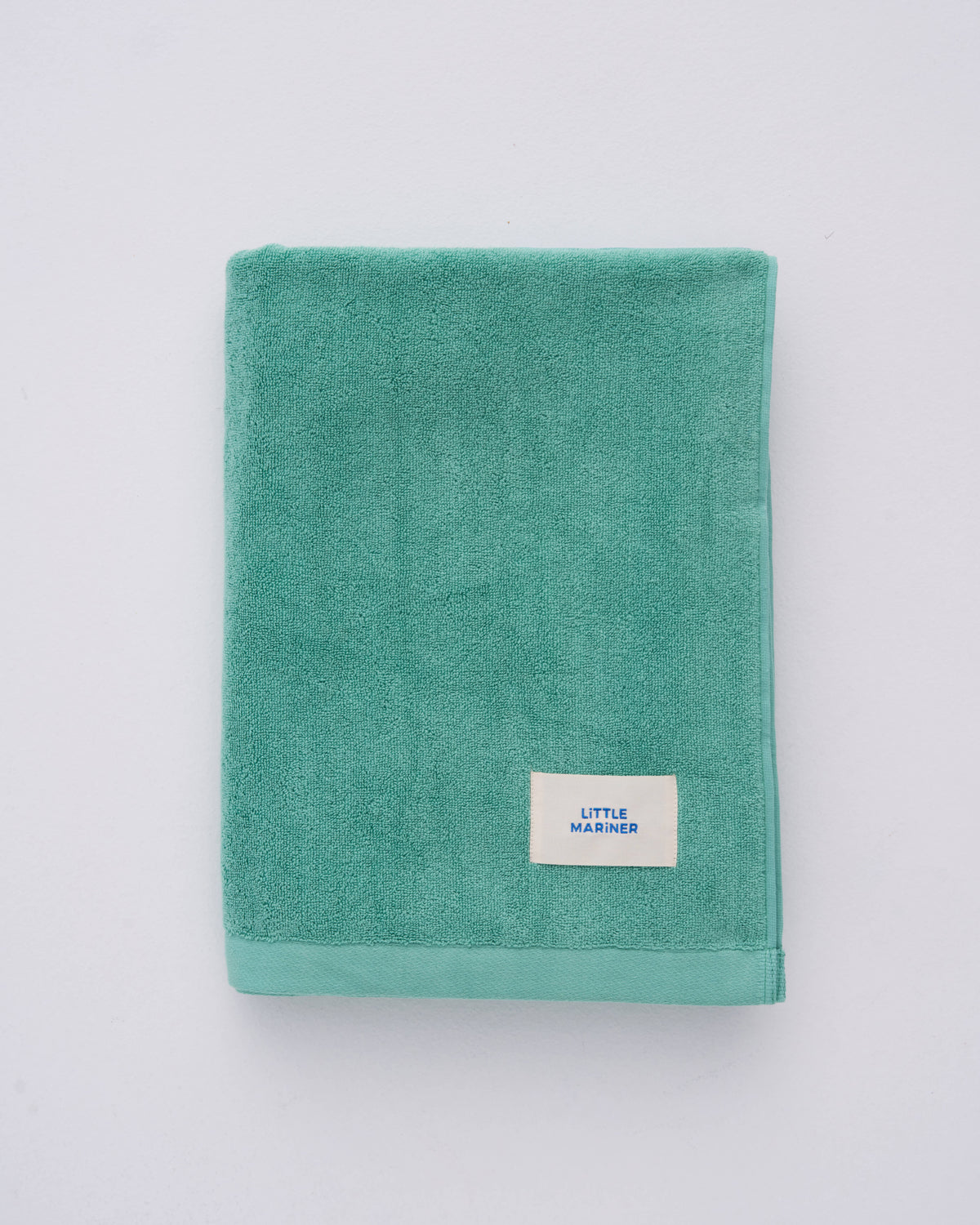 Sage green organic cotton beach towel by Little Mariner