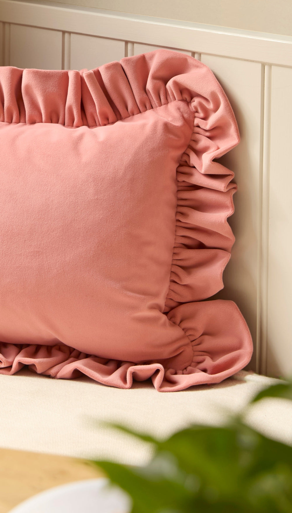 Oversized velvet cushion showing the gathered ruffle and rich fabric texture