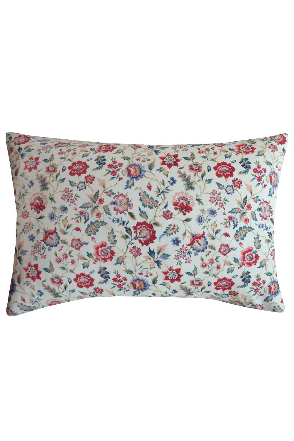 Floral patterned bedroom pillow on a white background