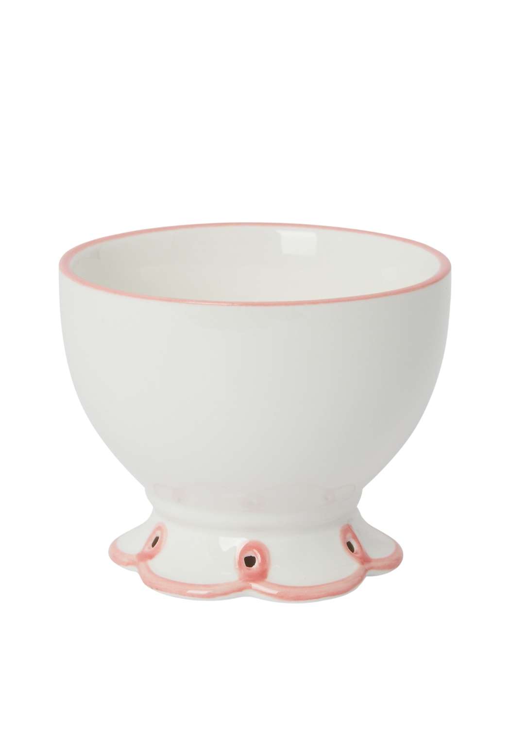 White ceramic bowl with pink rim and scalloped feet on a white background