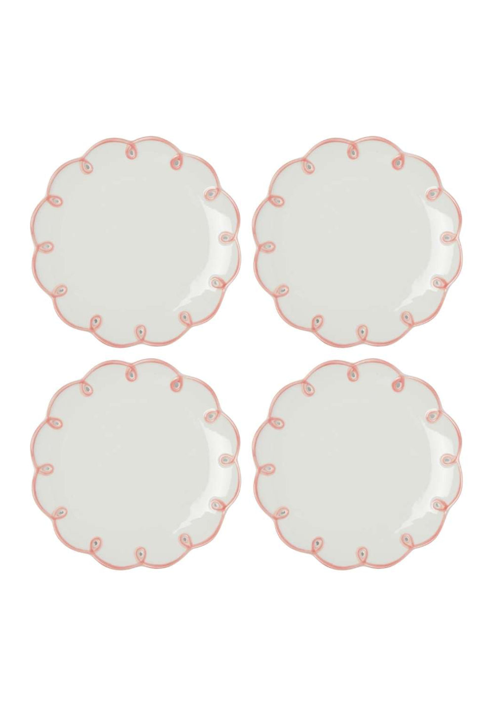 Set of four white plates with pink scalloped decorative edges on a white background