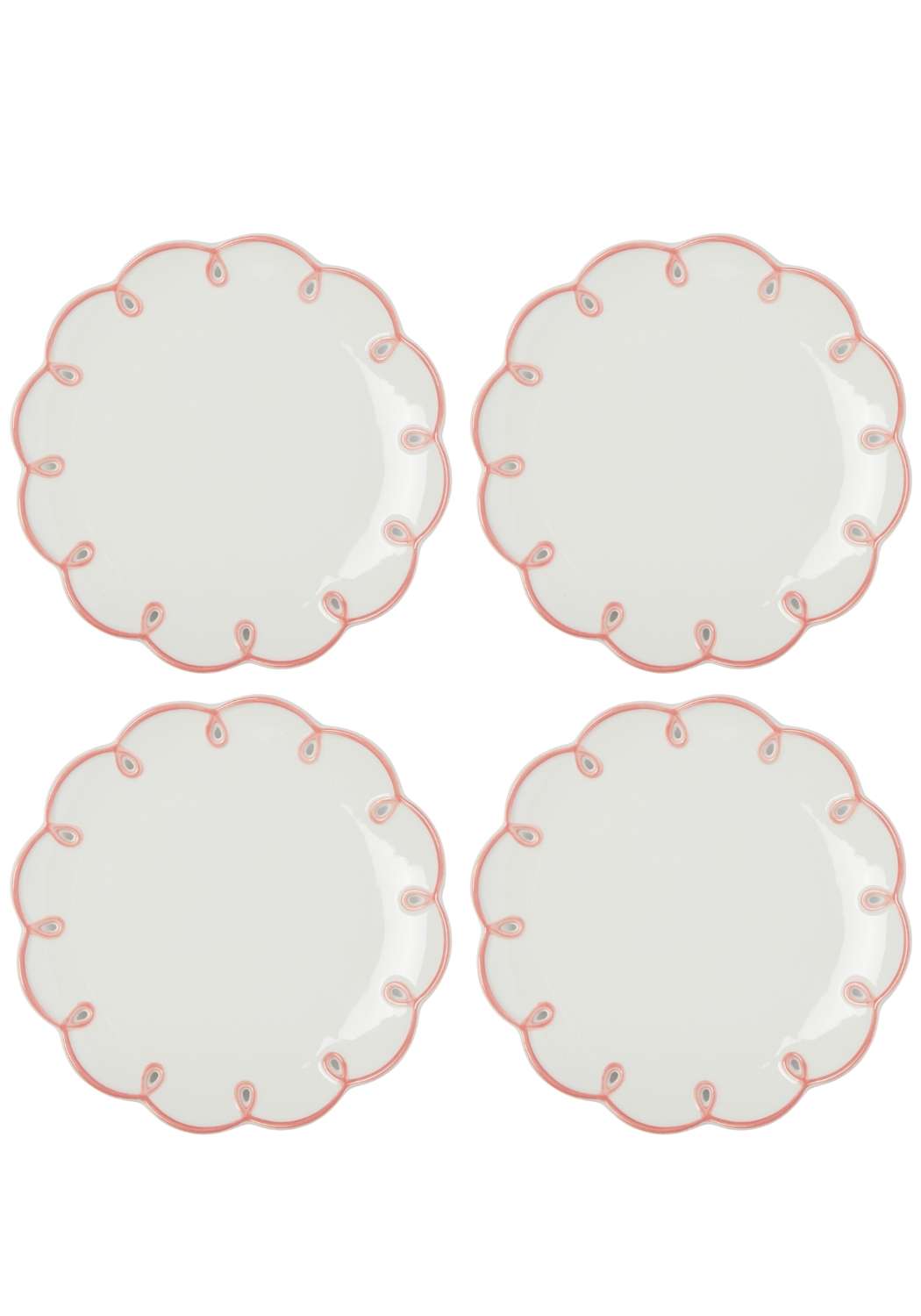 Four white plates with pink decorative scalloped edges on a white background