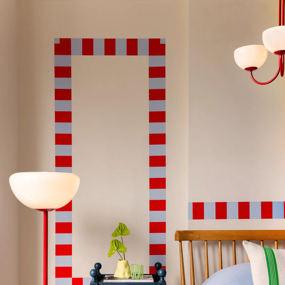 Red statement ceiling light styled in a contemporary interior