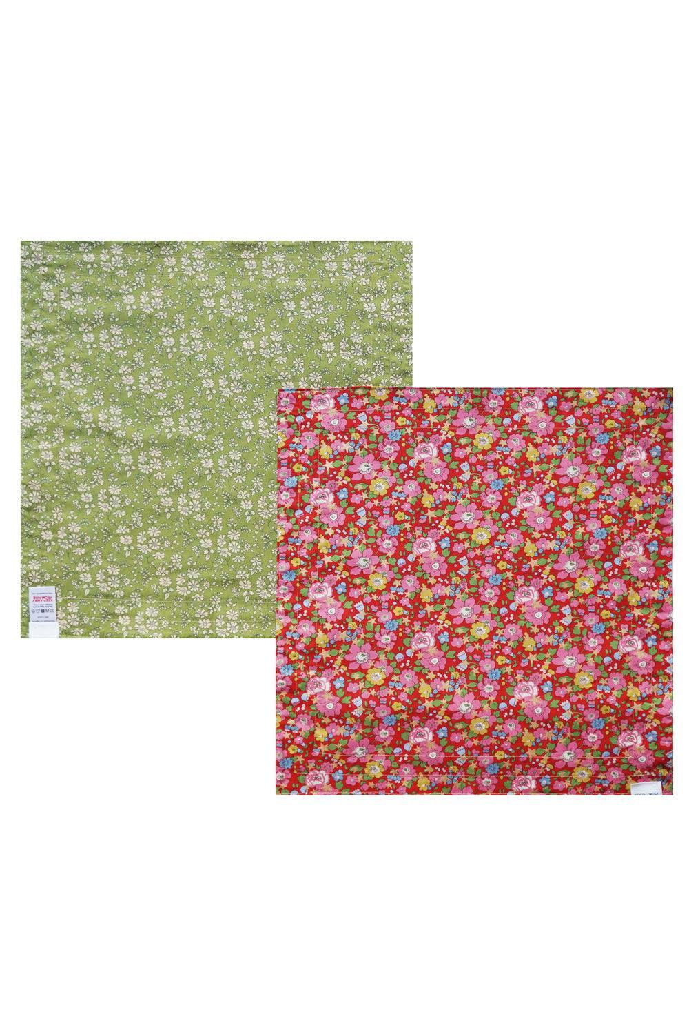 Two fabric napkins with floral patterns on a white background