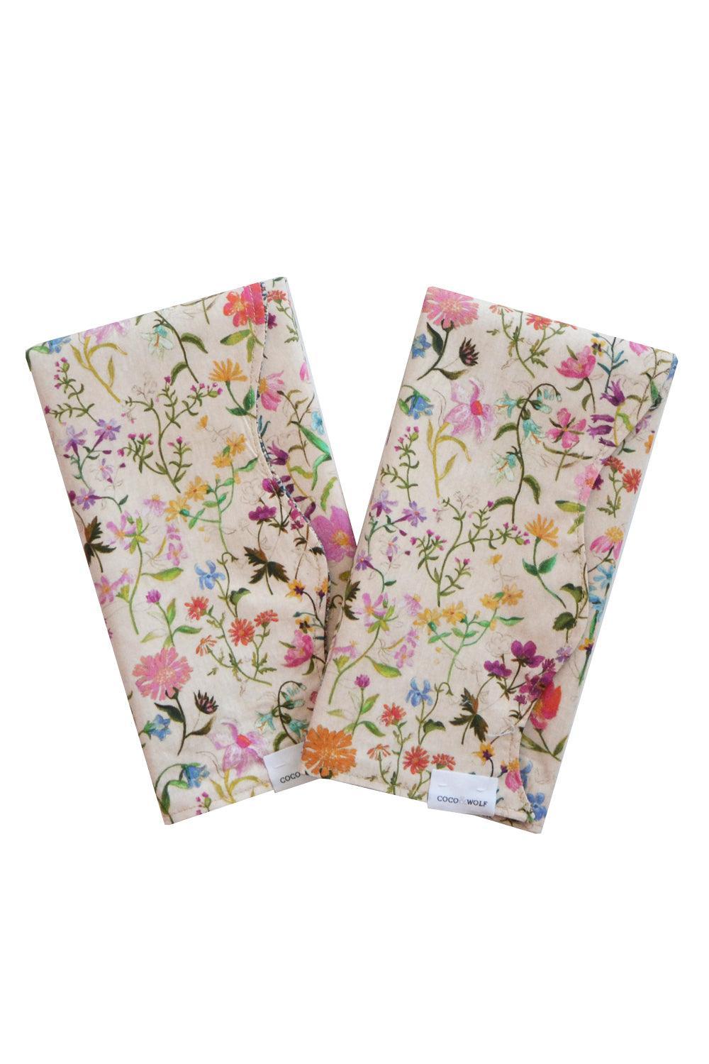 Two floral-patterned napkins called Linen Garden using Liberty Fabric on a white background