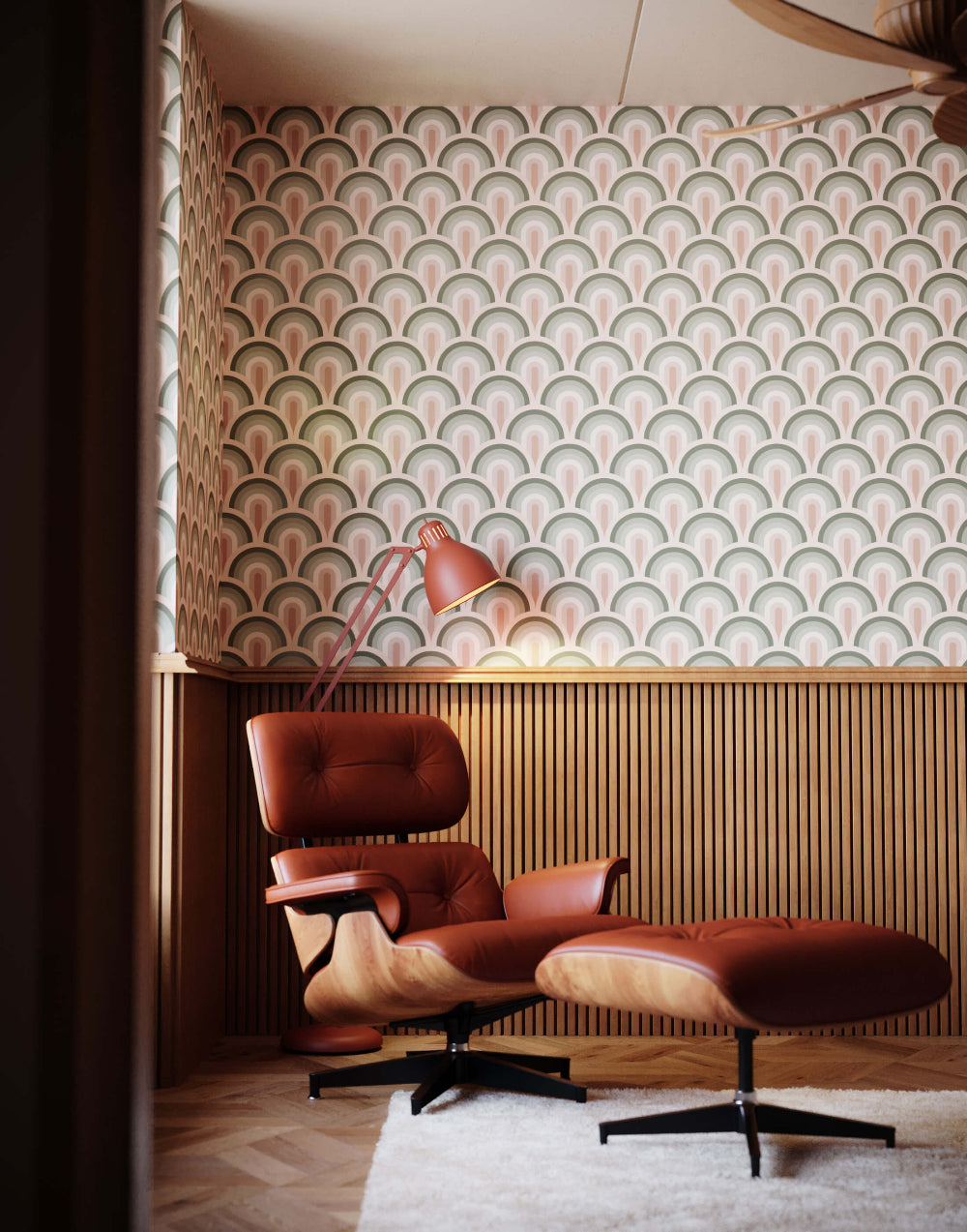 Brown Eames-style lounge chair and ottoman against a retro patterned wall.