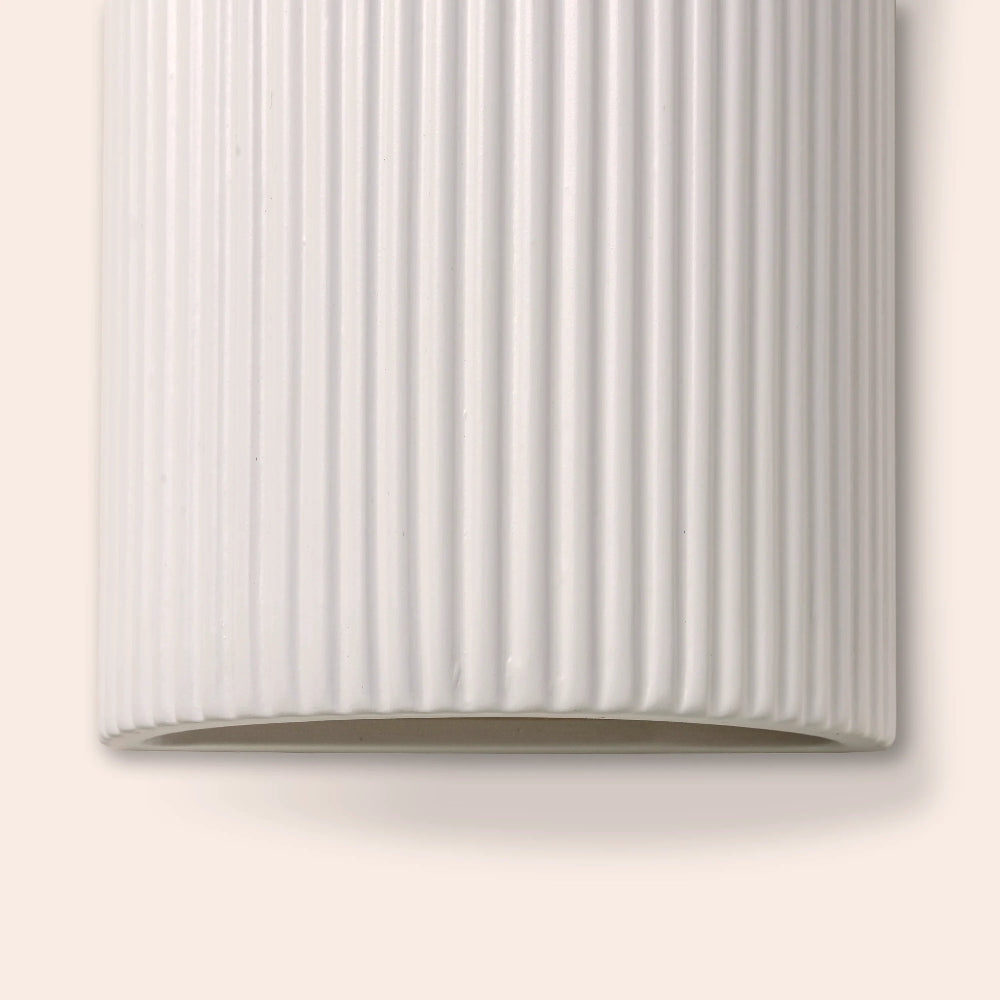 Close-up of the ribbed white ceramic wall light texture
