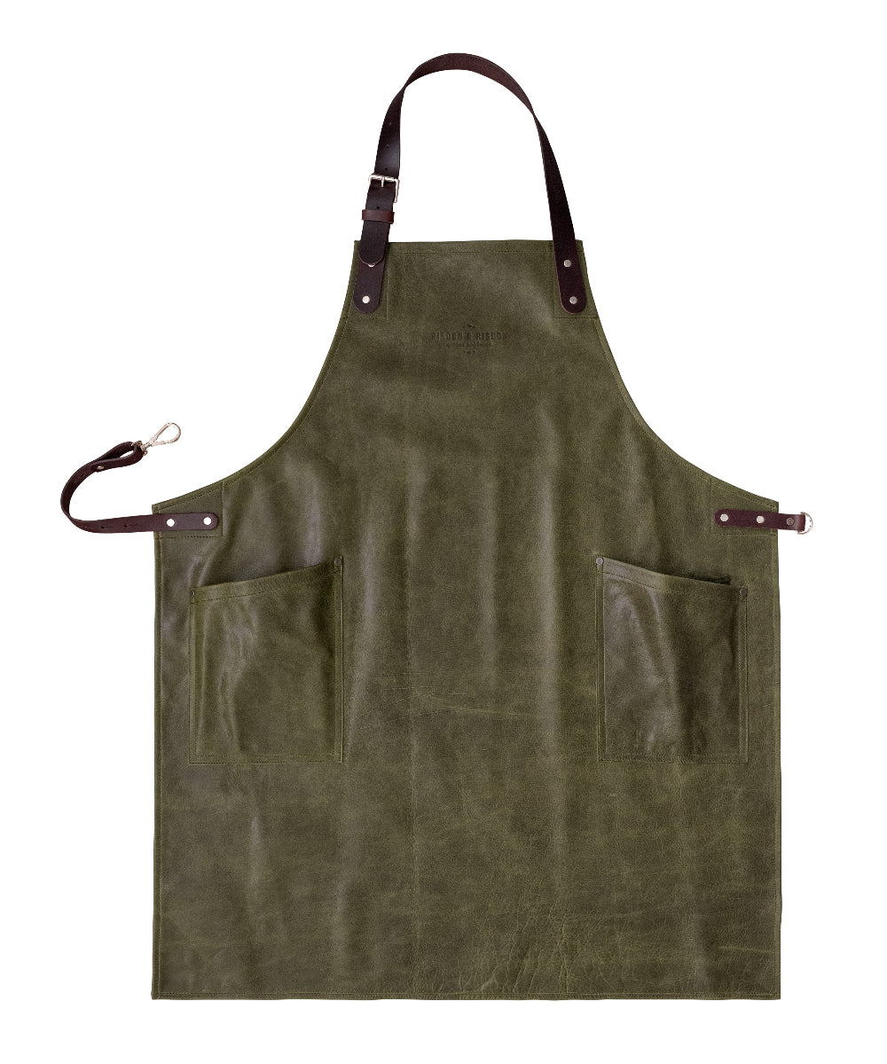Green apron with leather straps on a white background