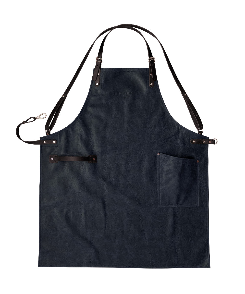 Black leather apron with brown straps on a white background