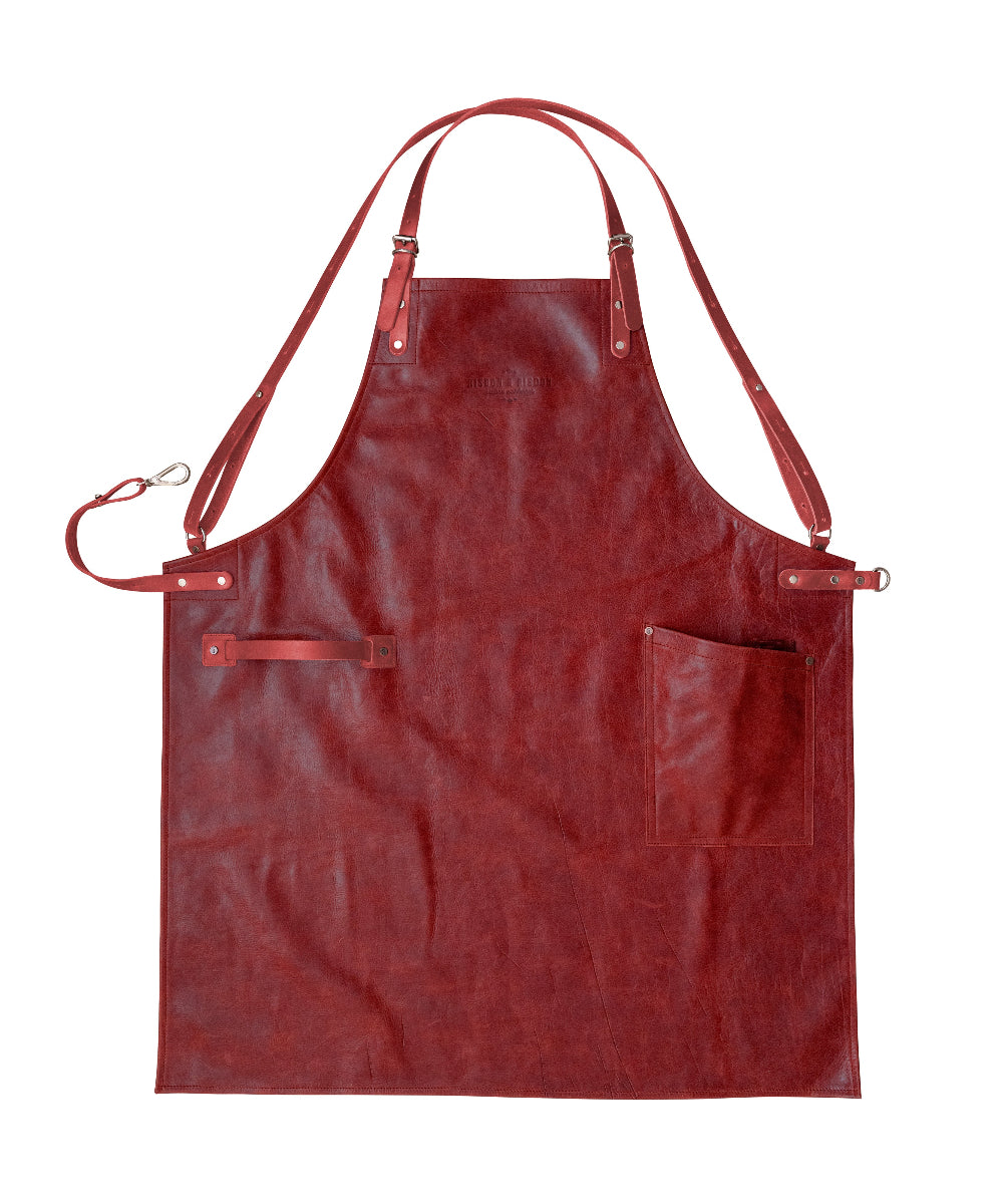 Red leather apron on a white background
