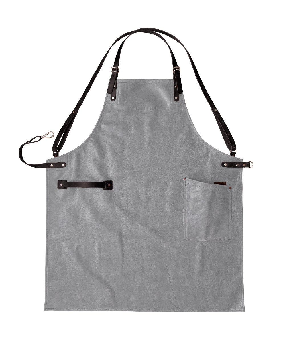 Grey apron with black straps on a white background