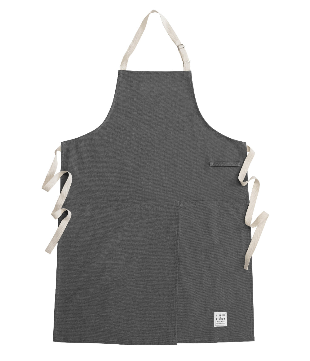Grey potters apron with white straps on a white background