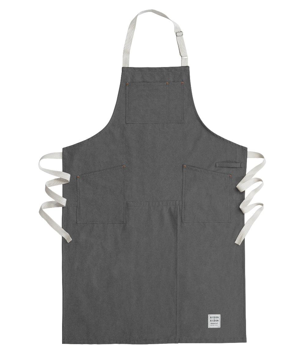Grey potters apron with white straps on a white background
