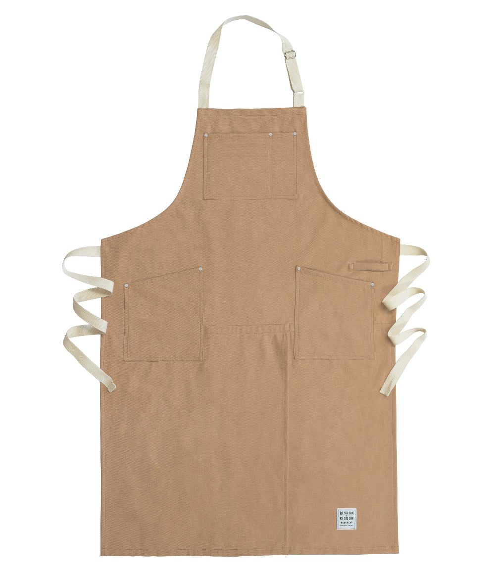 Brown potters apron with white straps on a white background