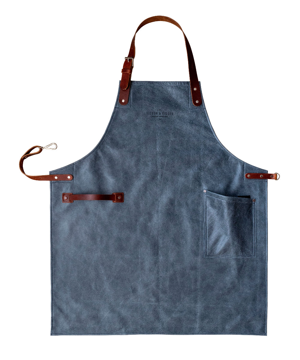 Blue apron with brown leather straps on a white background