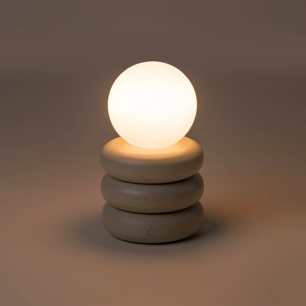 Front view of the rechargeable sand grey table lamp with cylindrical base
