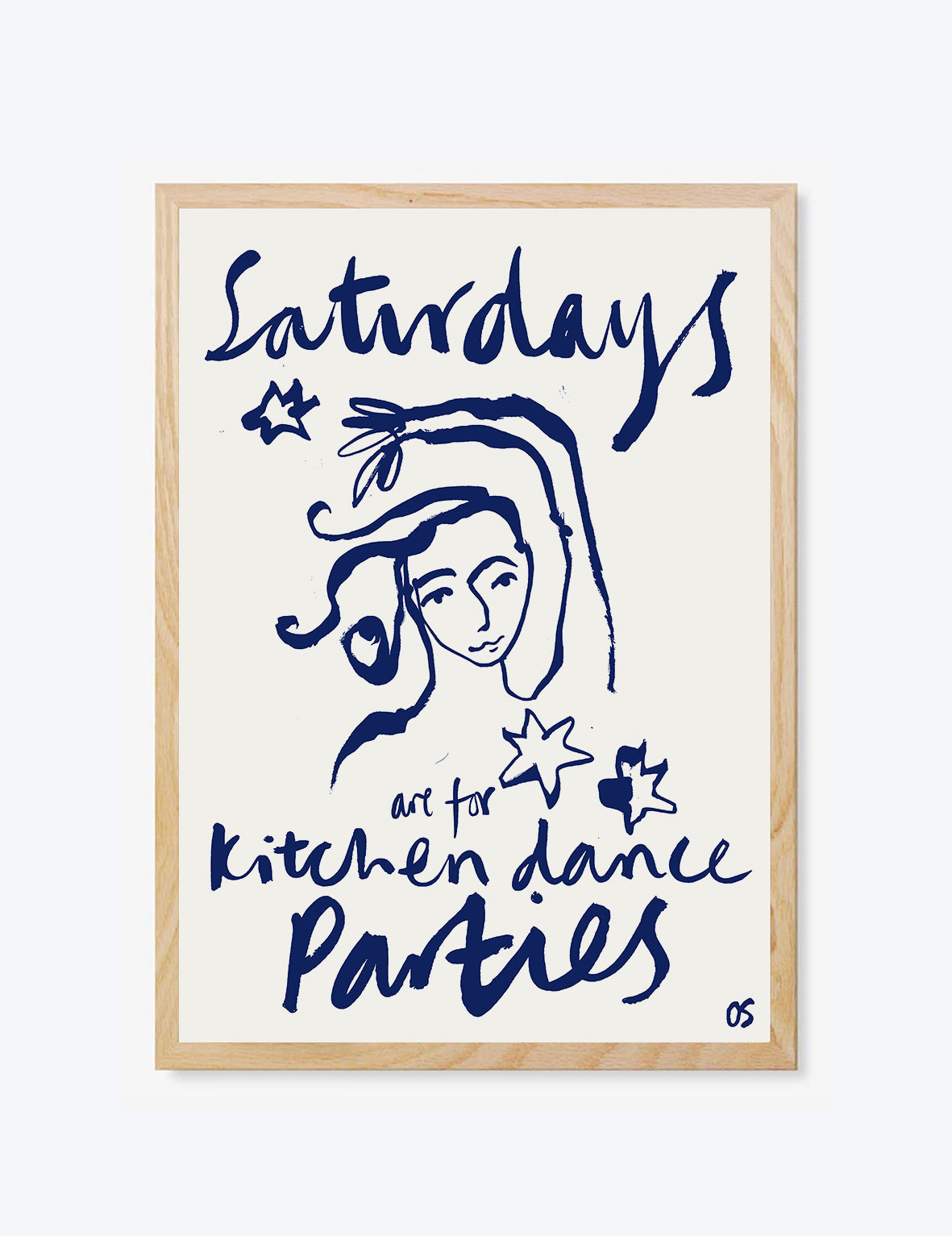 Framed artwork with a woman's face and text about Saturdays being for kitchen dance parties.