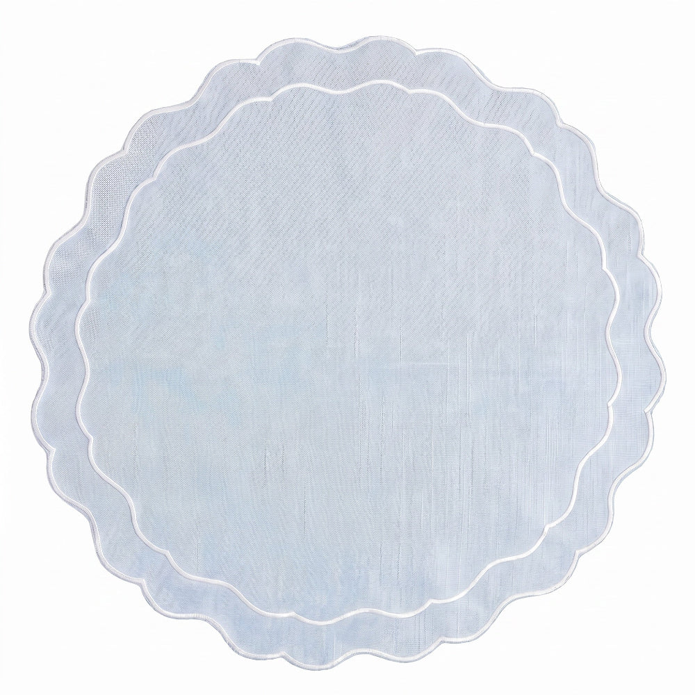 Round scalloped edge placemat on a white background