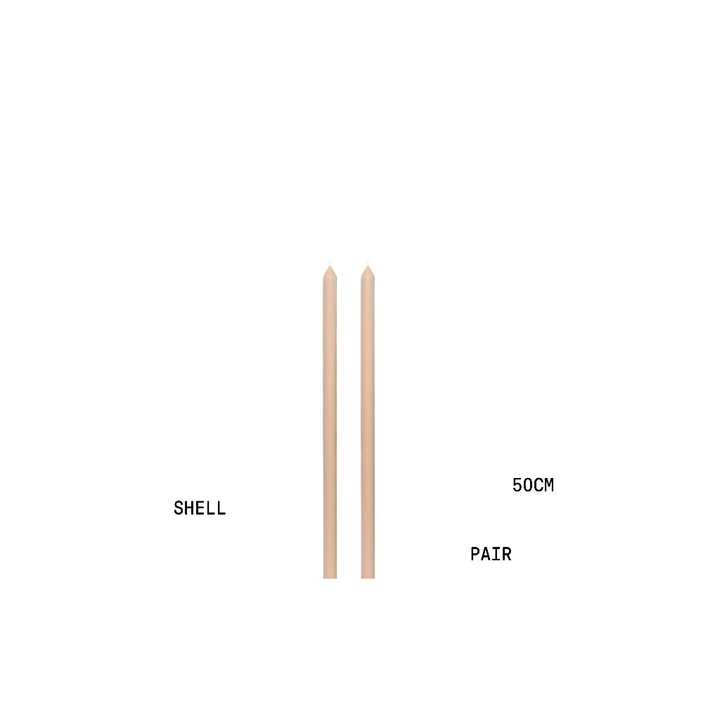 Two shell coloured tapered candles with measurement labels on a white background