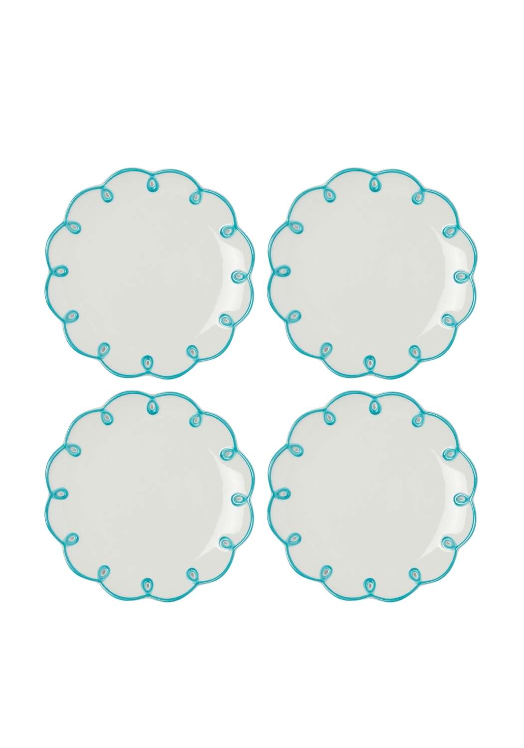 Four ceramic scalloped edge plates with blue decorative edges on a white background
