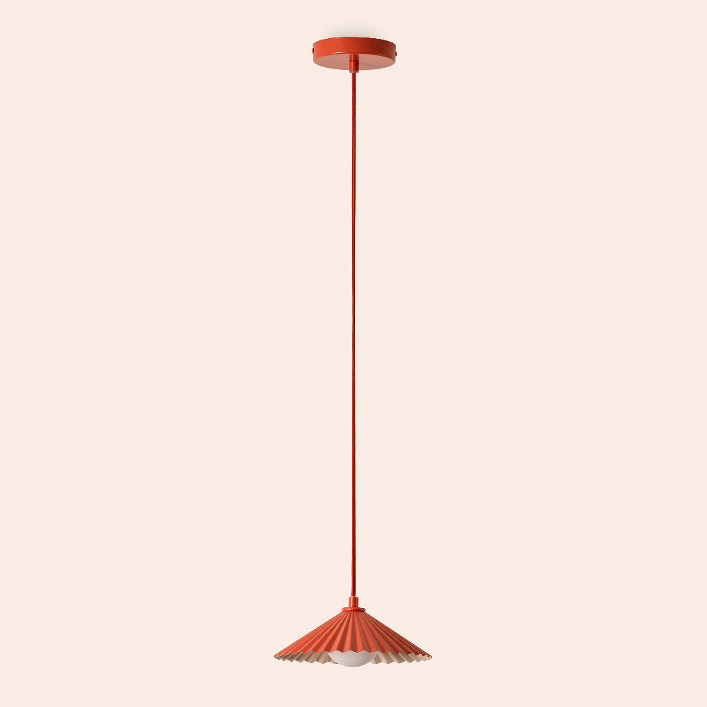 Small orange pendant light styled in a contemporary interior