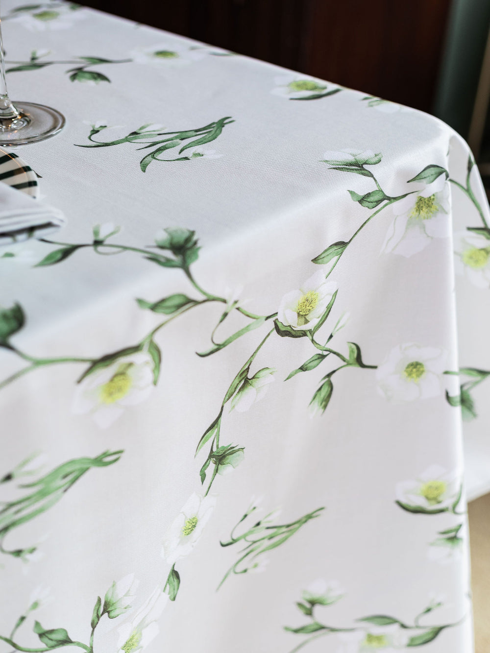 Tablecloth with green floral pattern snowdrop on a white background