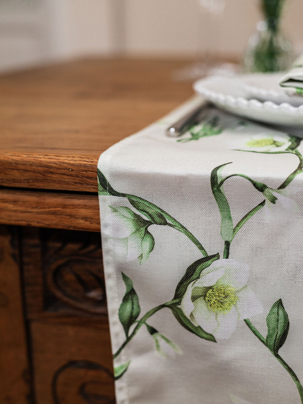 Table runner with floral design on a wooden table
