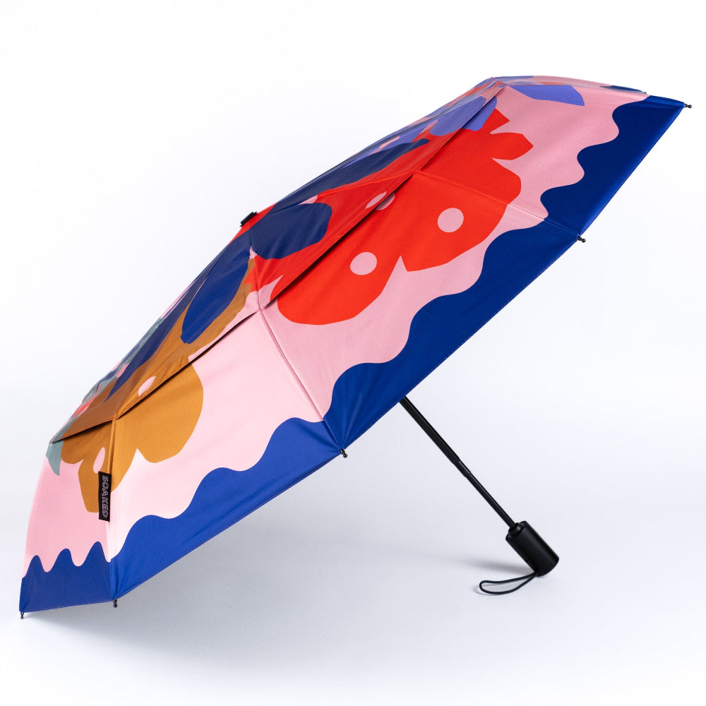 Colourful umbrella with abstract design on a white background