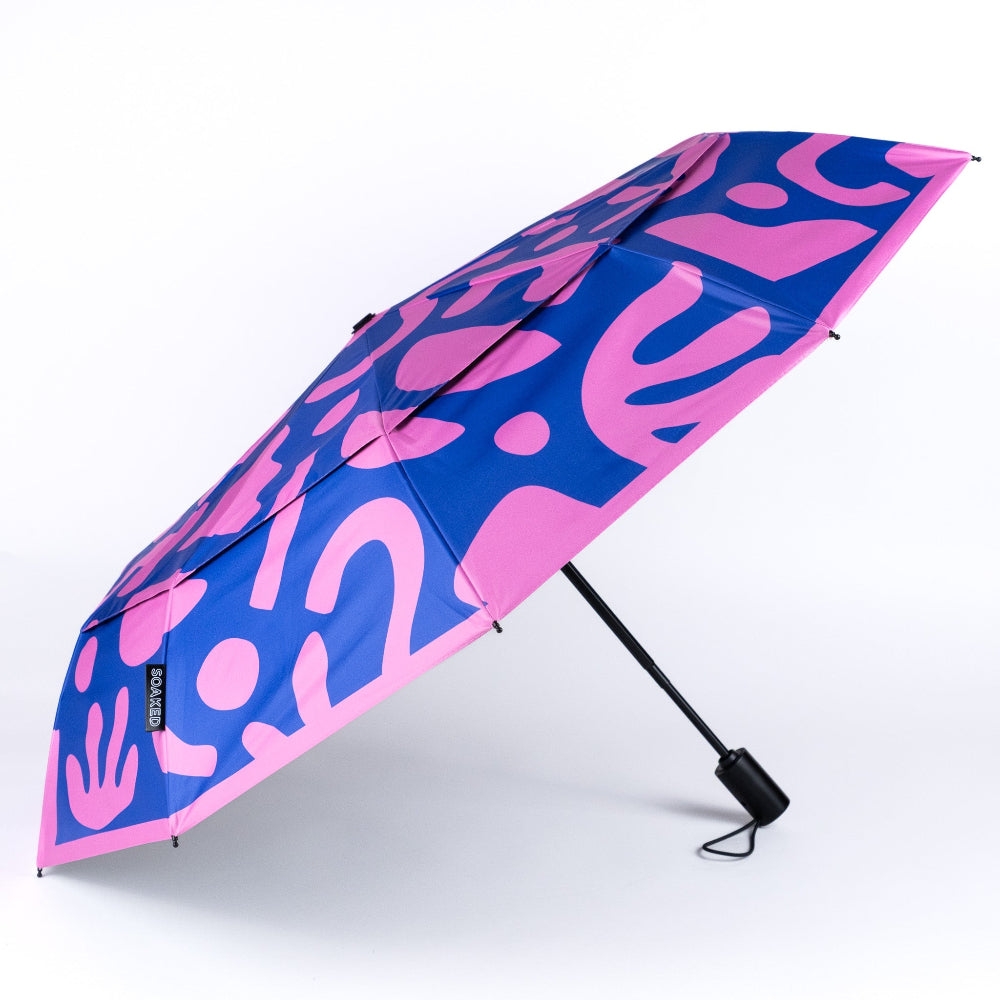 Blue and pink patterned umbrella on a white background