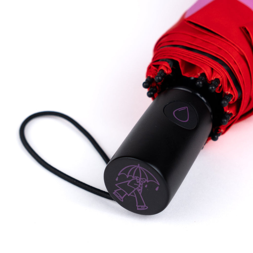 Black umbrella handle with red umbrella on a white background
