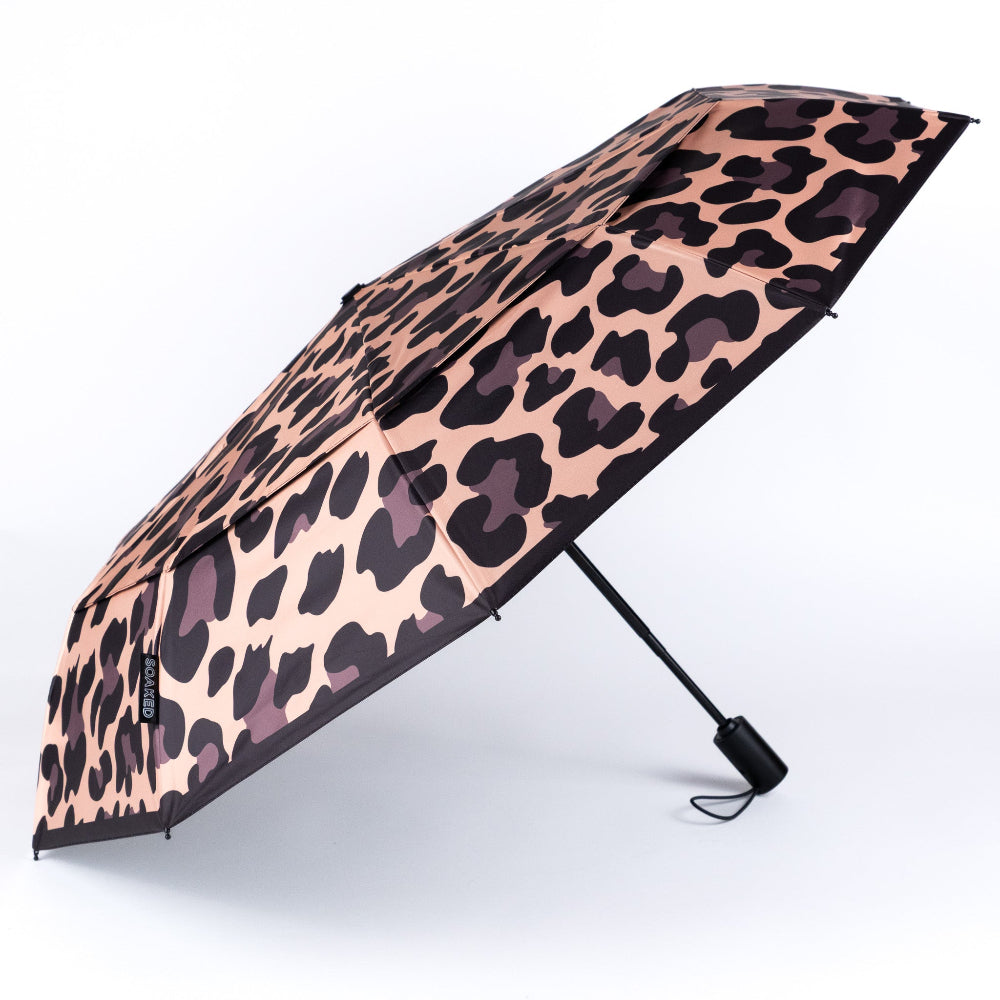 Leopard print umbrella on a white background