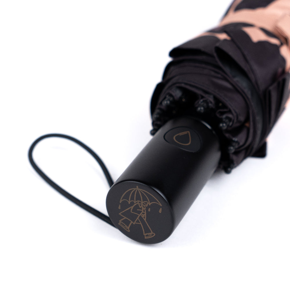 Black umbrella with a unique handle design on a white background