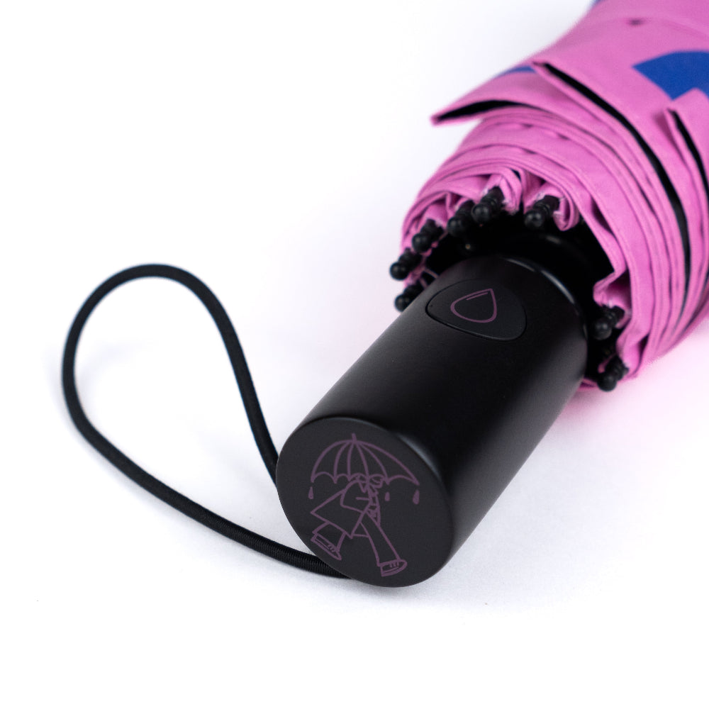 Black umbrella with pink canopy on a white background