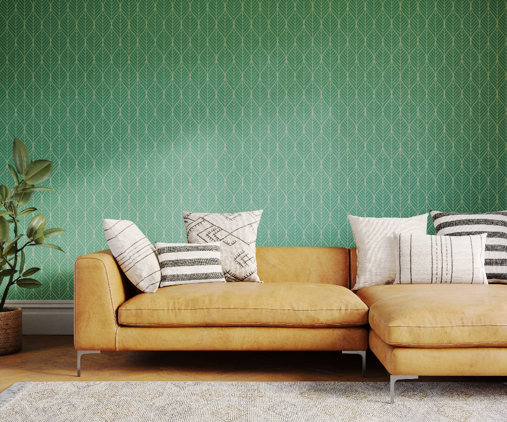 Yellow sectional sofa with patterned cushions against a green geometric wallpaper.