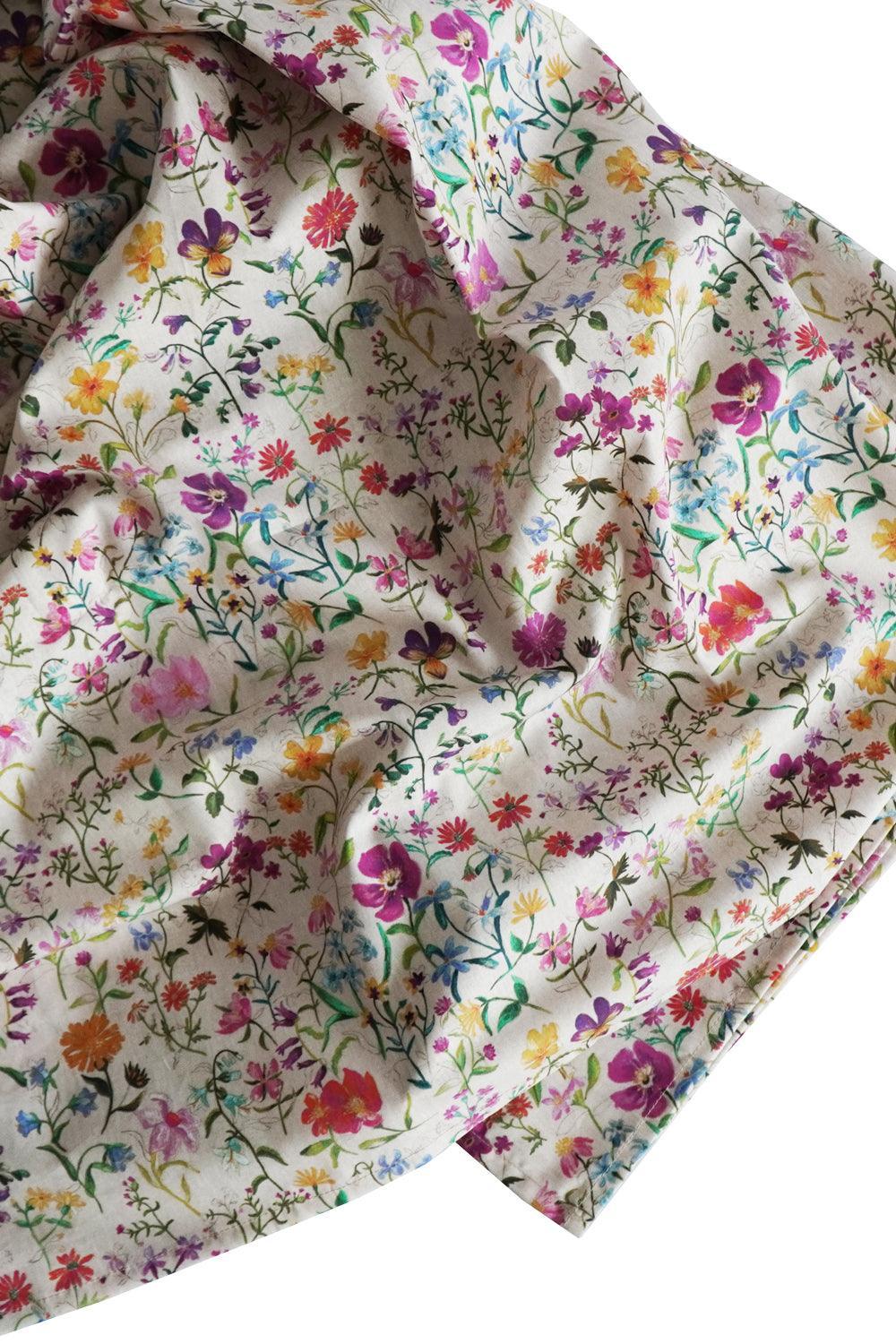 Linen Garden Liberty Floral fabric with colourful flowers on a white background