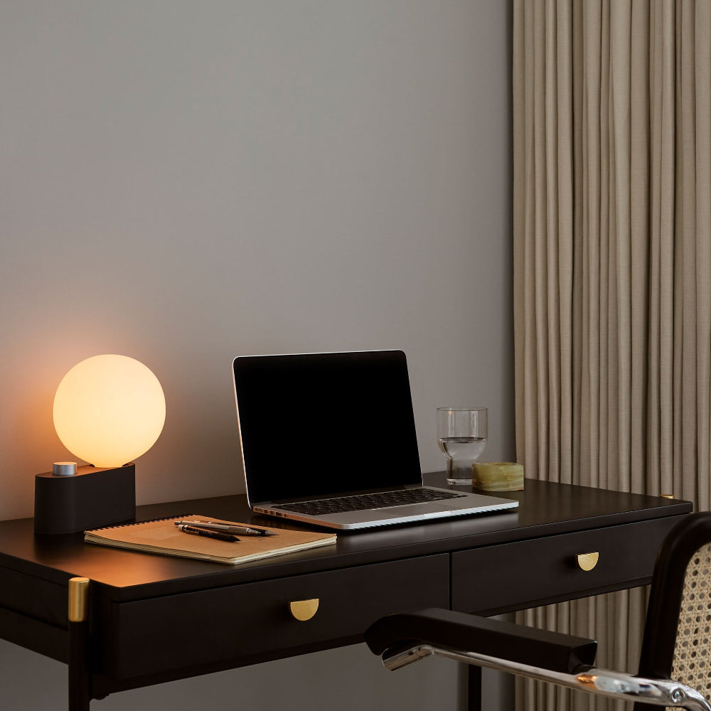Tala Alumina Charcoal wall sconce with spherical white bulb for desk office