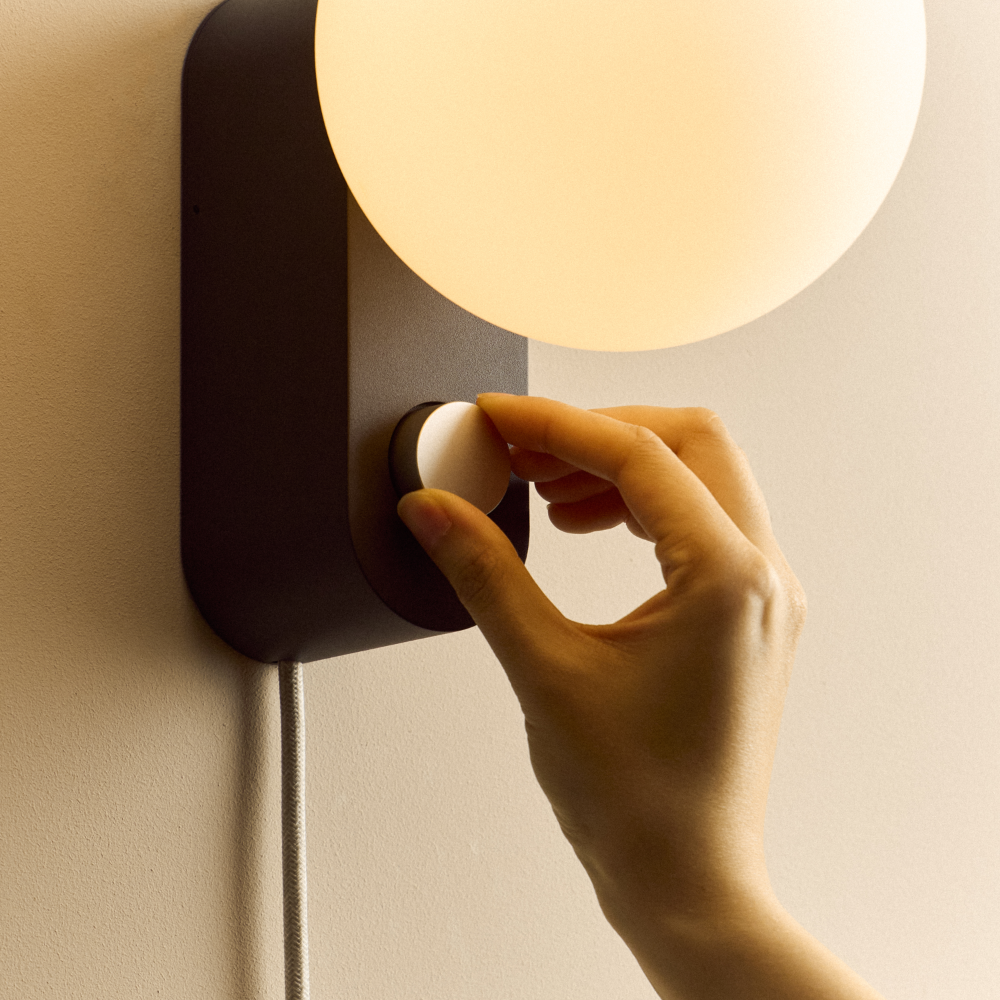 Tala Alumina Charcoal wall sconce with spherical white bulb