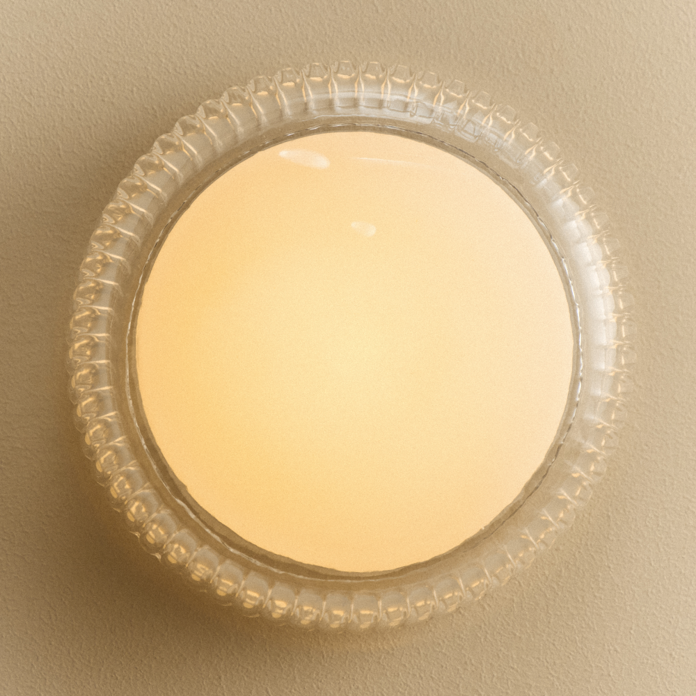 Tala Firth Wall Light illuminated with warm diffused light