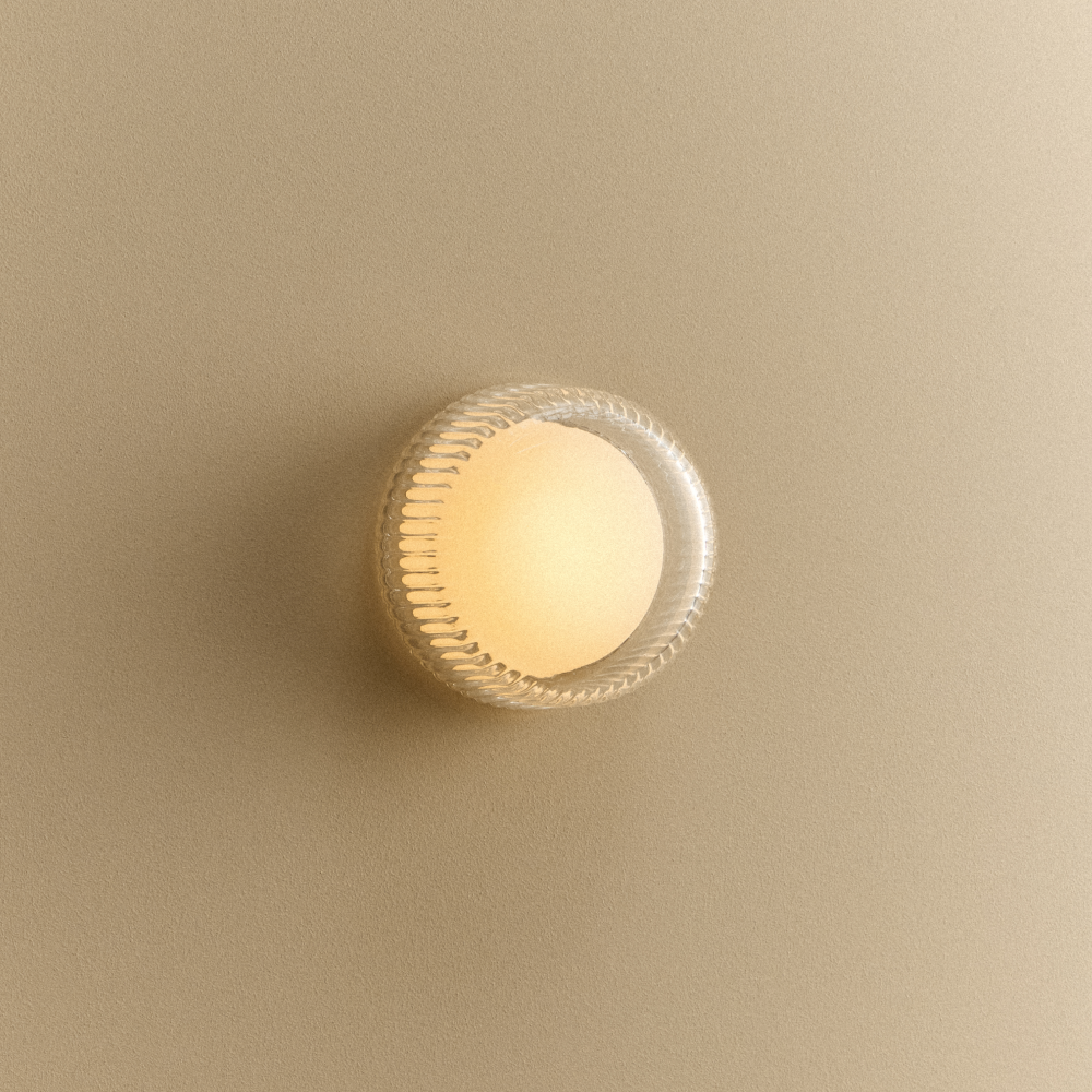 Tala Firth Wall Light in clear ribbed glass with light on
