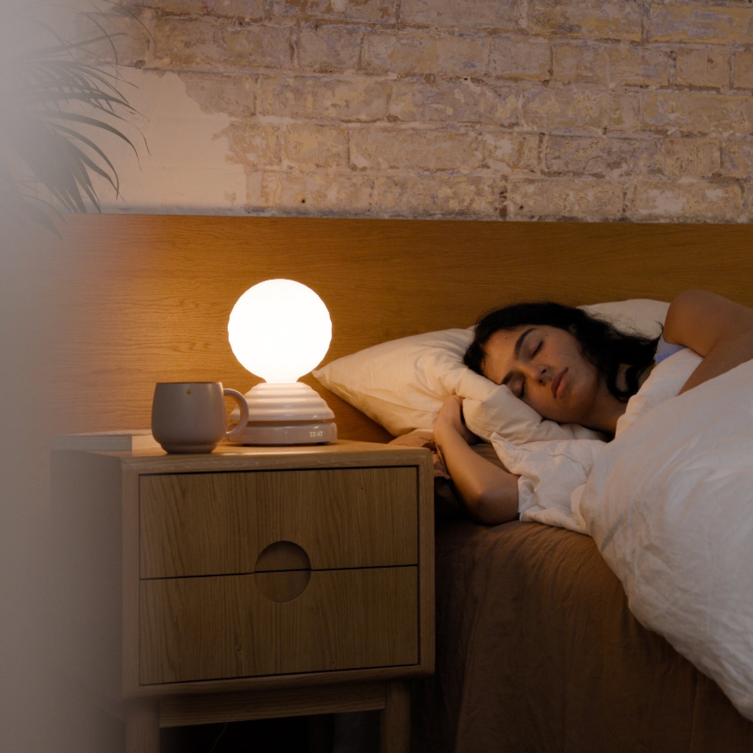 Tala Wake Sleep Light in Pebble White as a table lamp