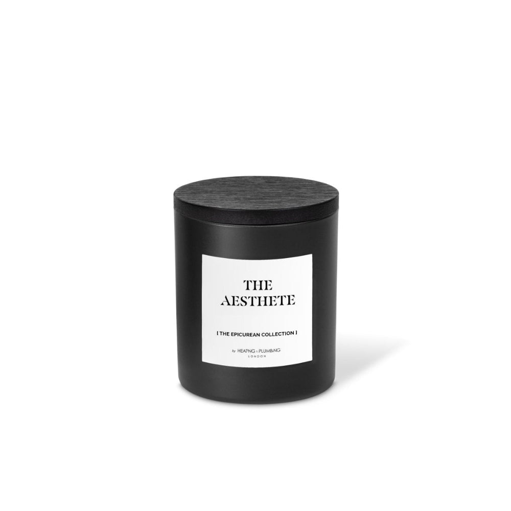 Black candle with 'The Aesthete' label on a white background