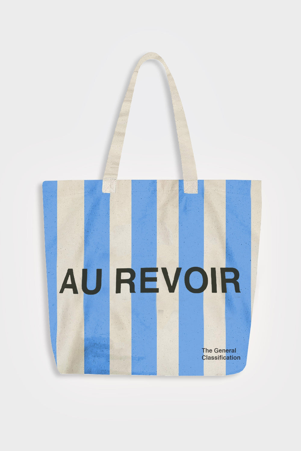 Striped tote bag with 'AU REVOIR' text on a white background