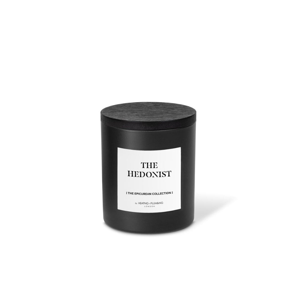 Black candle with 'The Hedonist' label on a white background